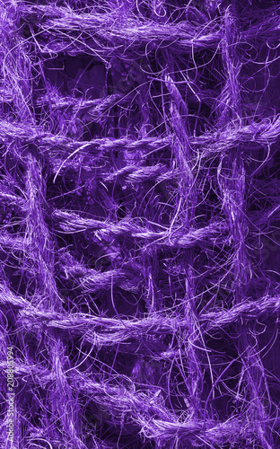 Abstract view of a coconut rope toning in ultra violet. Unusual texture background.