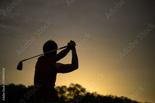 silhouette asian golfer playing golf during beautiful sunset,Thailand people