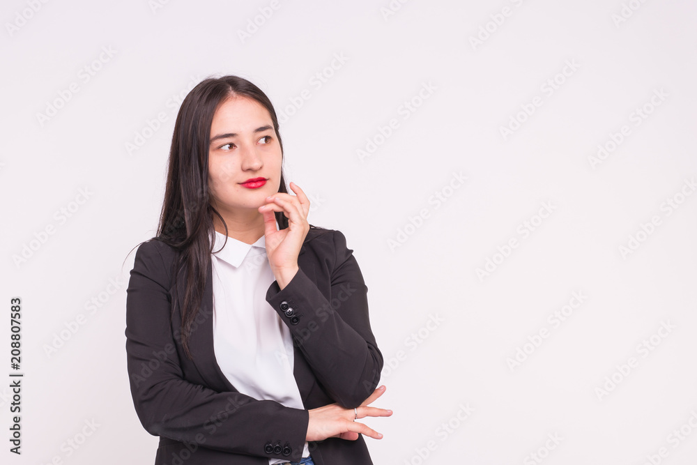 Smiling beautiful young asian woman with hand on her chin Smiling beautiful young asian woman with hand on her chin