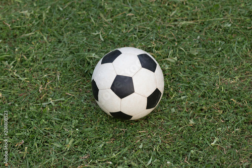 Soccer ball on the grass in the countryside.