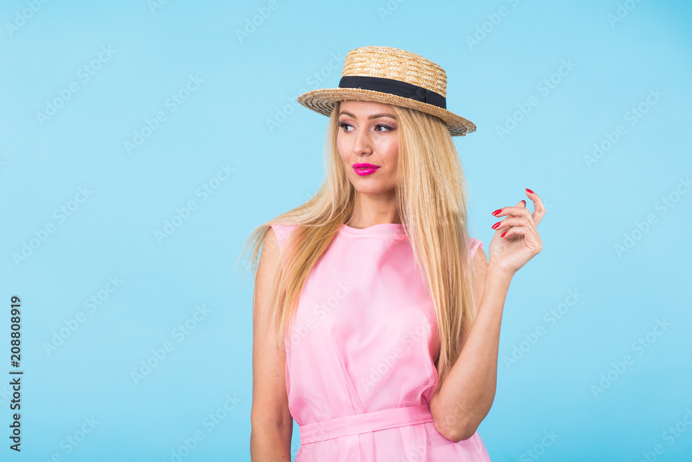Young woman fashion lookbook model studio portrait on blue background with copyspace