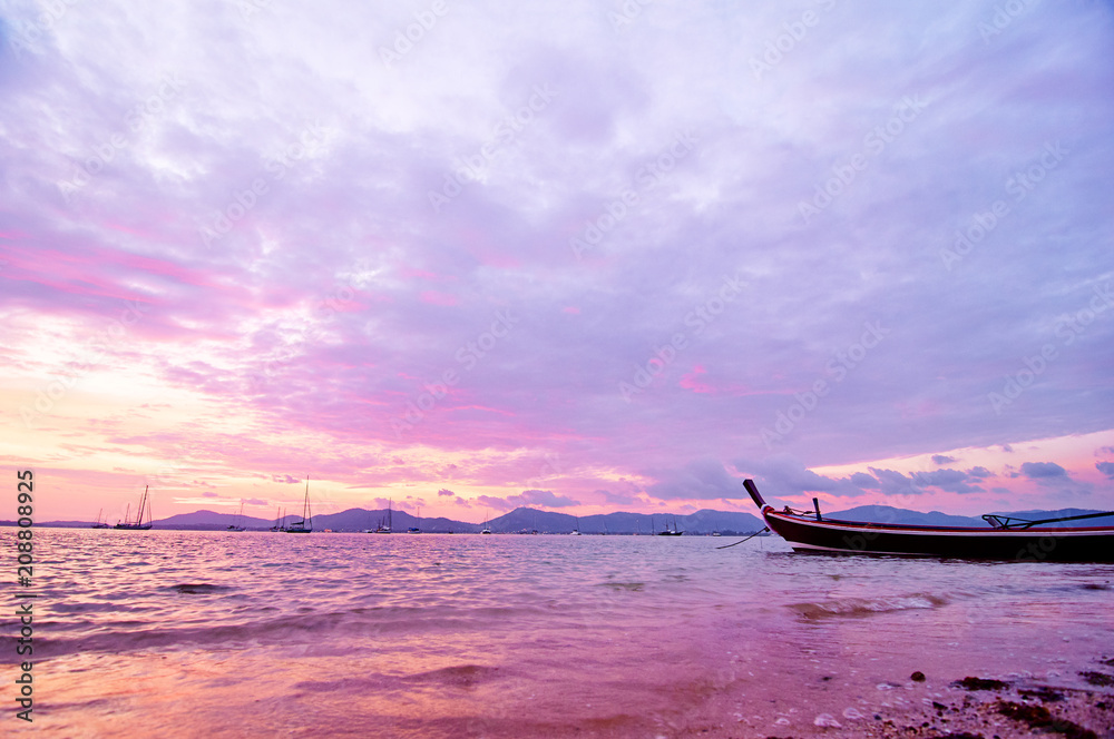 Travel in Thailand. Colorful landscape with sea beach, traditional longtail boat over beautiful sunset background. Travel in Thailand. Colorful landscape with sea beach, traditional longtail boat over beautiful sunset background.