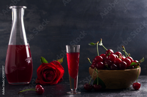 Photography Homemade cherry alcohol drink liquor with fresh cherry berries