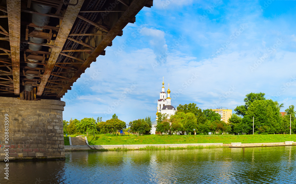 Naklejka premium View of the embankment and Epiphany Cathedral from under bridge in Oryol, Russia