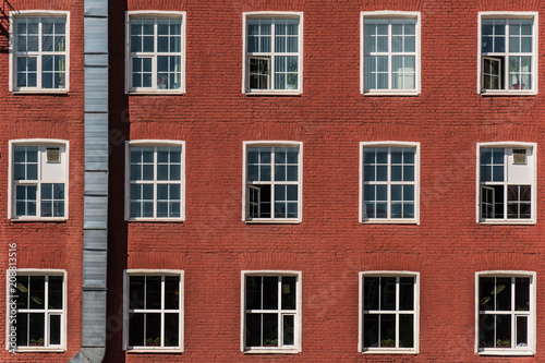 Building with windows made of red brick © a_medvedkov