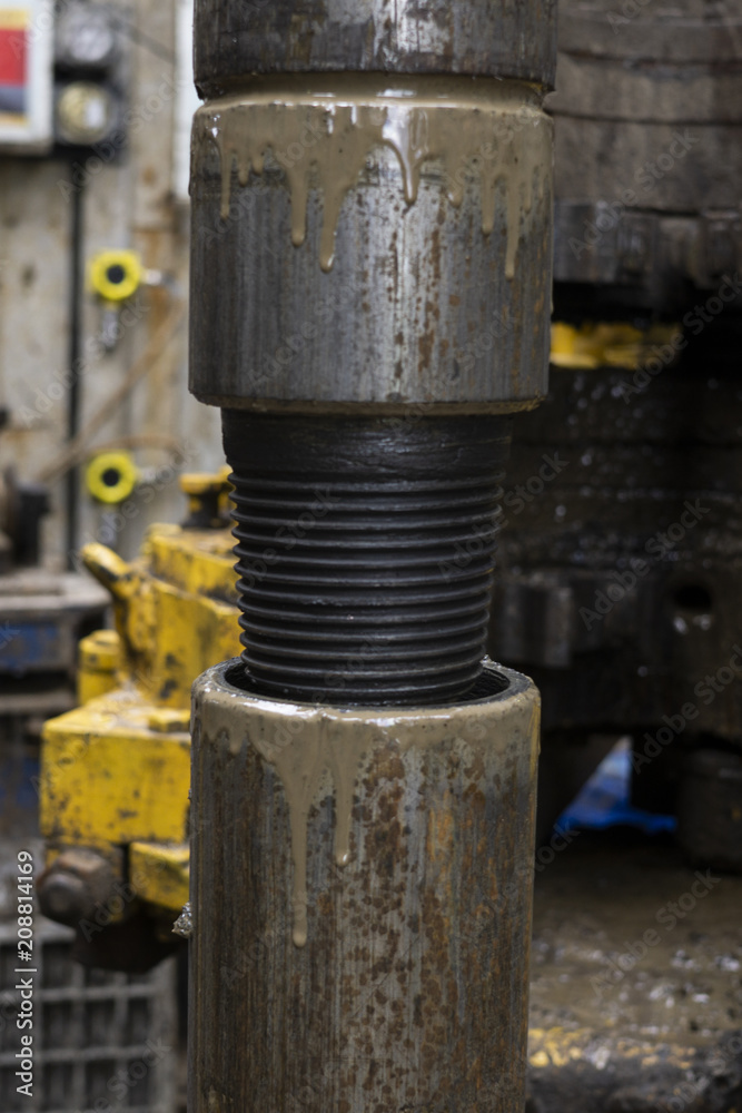 Drilling pipe. turned the drill pipe with a drilling wrench. Drilling of oil and gas wells. Oil industry. Oil drill pipe. Threaded connection
