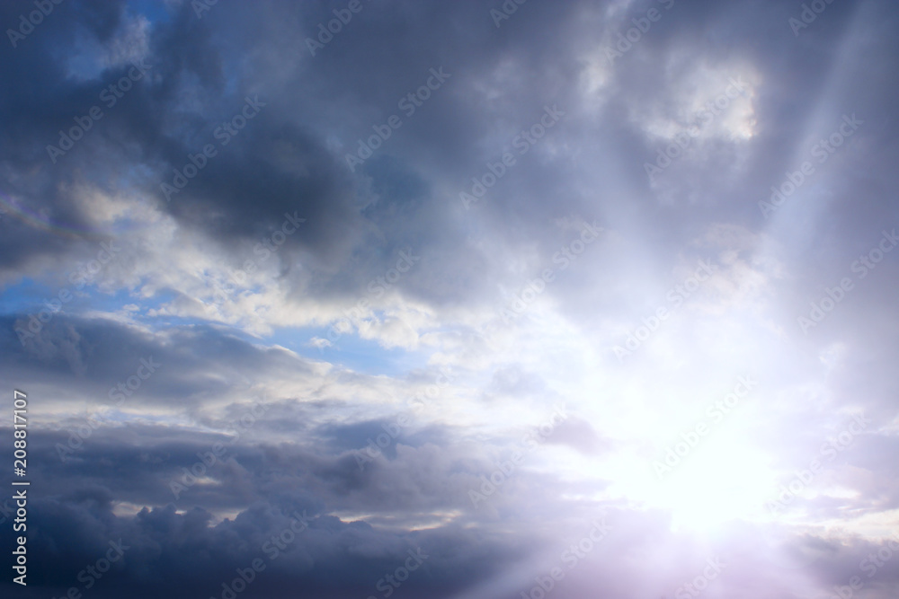 Evening sky with clouds and sunny rays. Sunset of sun