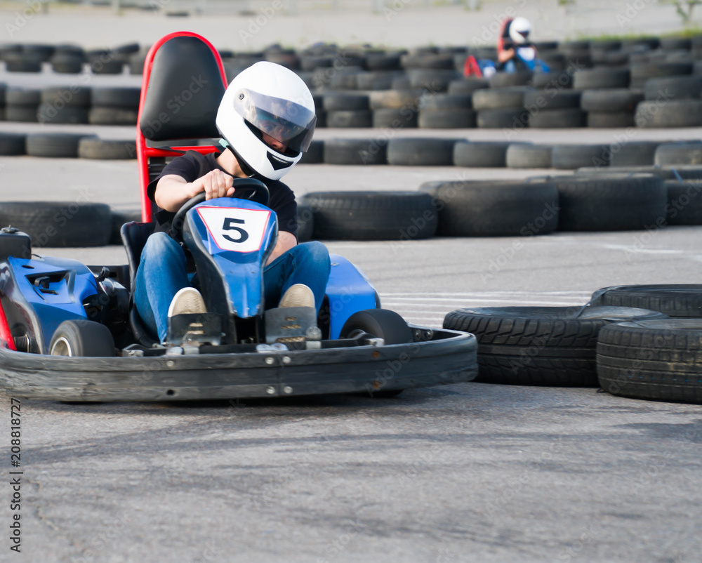 Kart crossing the finish line action, speed, helmet, track, driver, competition, motor, motion, adrenalin