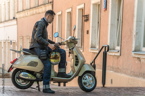 Man presents his classic scooter