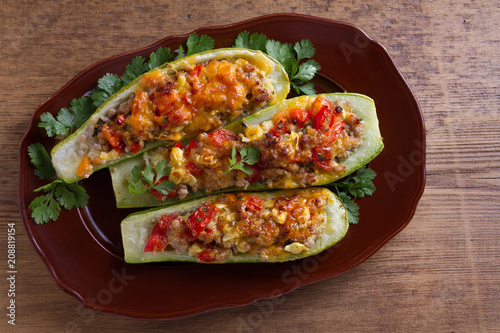 Zucchini stuffed with meat, vegetables and cheese. Zucchini boats. View from above, top studio shot