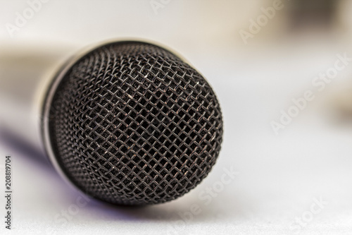 Microphone, selective focus, on a light background, close up © maykal