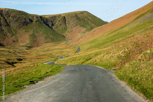 The winding single track road through the Newlands Pass in the  English Lake District photo