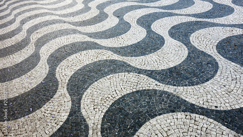 Lisbon pavement waves Handmade pavement (Calçada portuguesa) in Lisbon, Portugal. Praça Dom Pedro IV.          