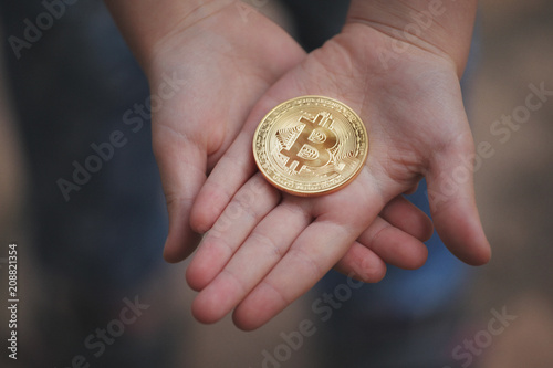 bitcoin coin children hands 