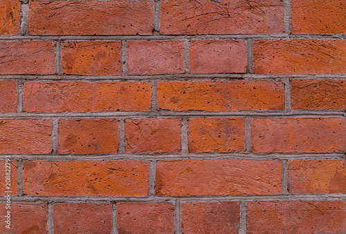 brick wall with gray cement line red orange blocks grunge background