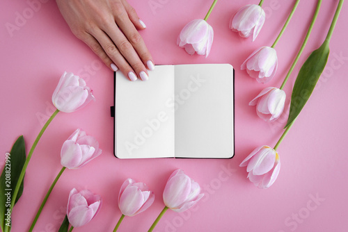Manicure, notebook and flowers