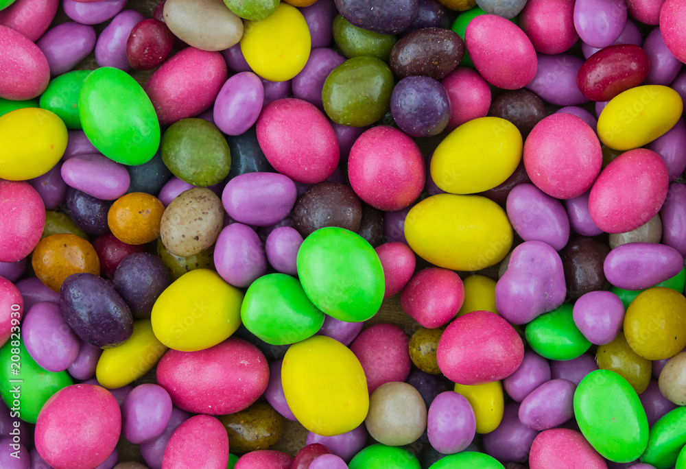 confectionery background sweets with multicolored sugar icing dragee green red lilac festive base wrapper confectionery background sweets with multicolored sugar icing dragee green red lilac festive base wrapper