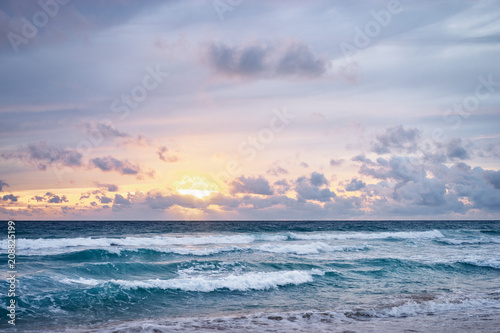 Stormy weather. Beautiful seascape with cloudy sky. Sunset on the beach.