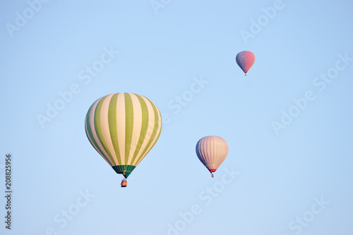 Aerostatics and aeronautics. Airbaloons against blue sky. © luengo_ua