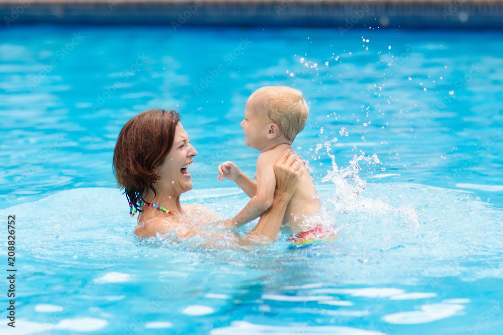 Mother and baby in swimming pool