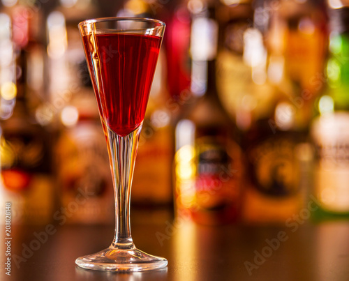 refreshing liqueur in a tall glass, alcoholic drink prepared by the bartender © Q77photo