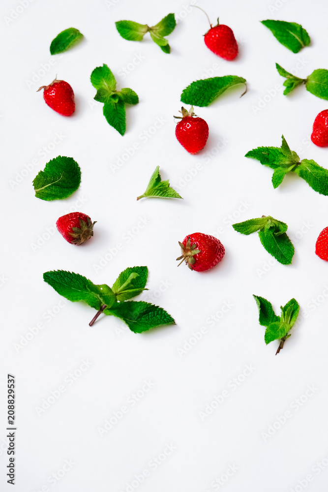 Pattern of leaves of fresh mint and strawberry. Top view. Pattern of leaves of fresh mint and strawberry. Top view.