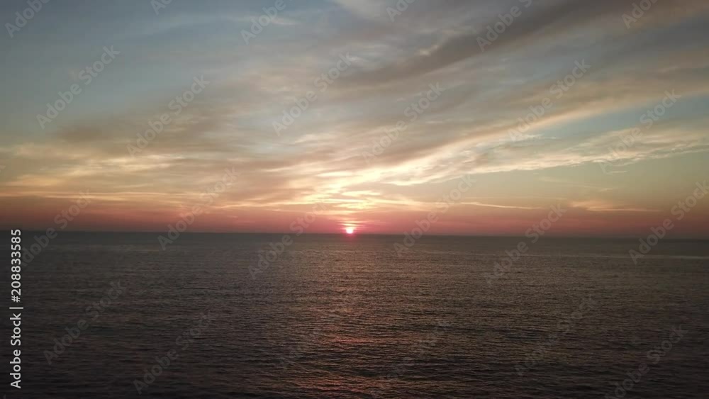 Sunset over ocean by aerial drone Sunset over ocean by aerial drone