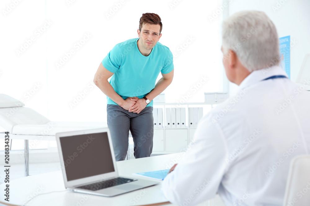 Man with health problems visiting urologist at hospital Man with health problems visiting urologist at hospital