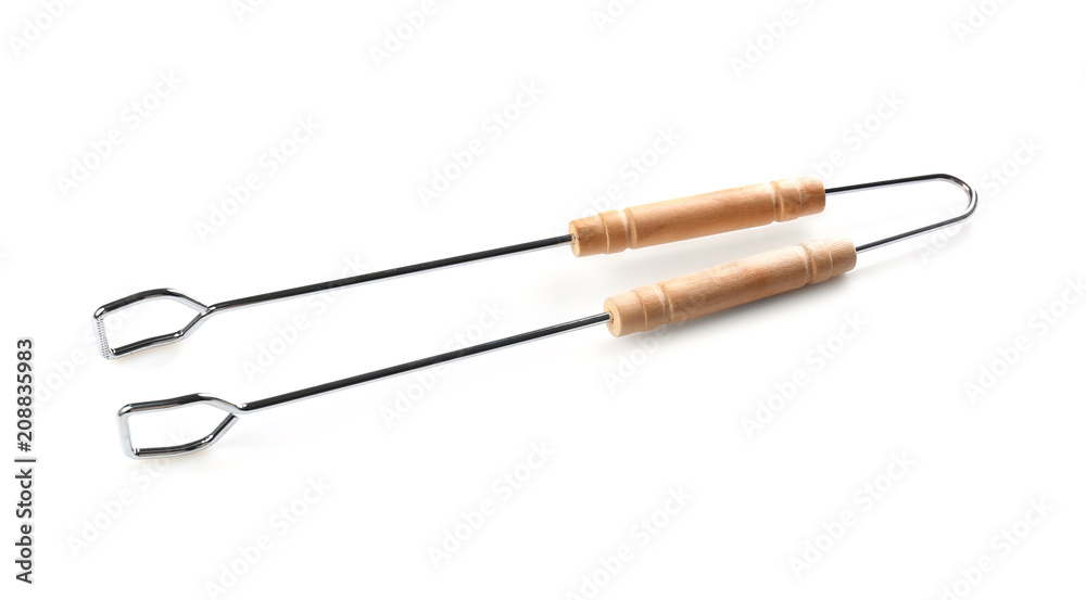 New barbecue tongs with wooden handle on white background New barbecue tongs with wooden handle on white background