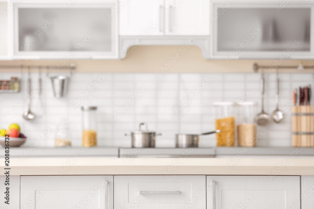 Countertop and blurred view of kitchen interior on background Countertop and blurred view of kitchen interior on background