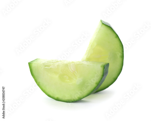 Slices of fresh cucumber on white background