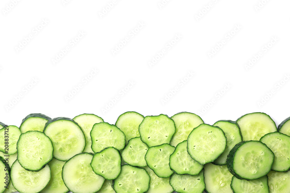 Slices of cucumbers on white background, top view Slices of cucumbers on white background, top view