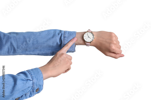 Young woman with wristwatch on white background. Time concept