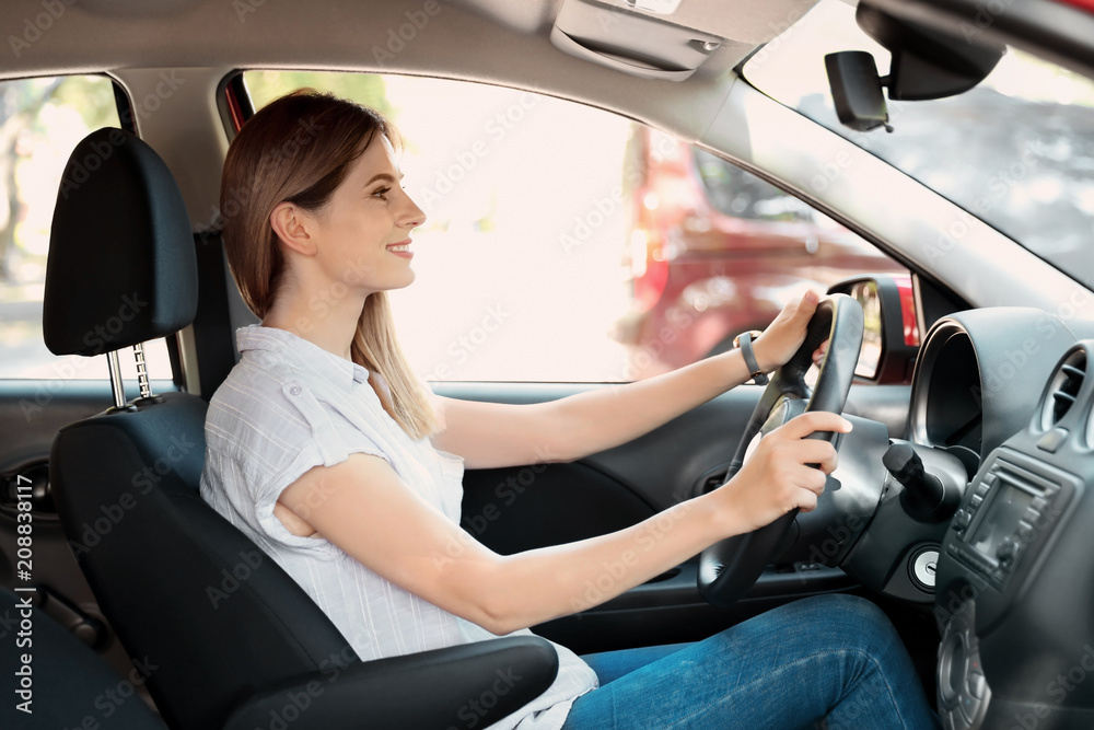Happy beautiful woman driving modern car Happy beautiful woman driving modern car