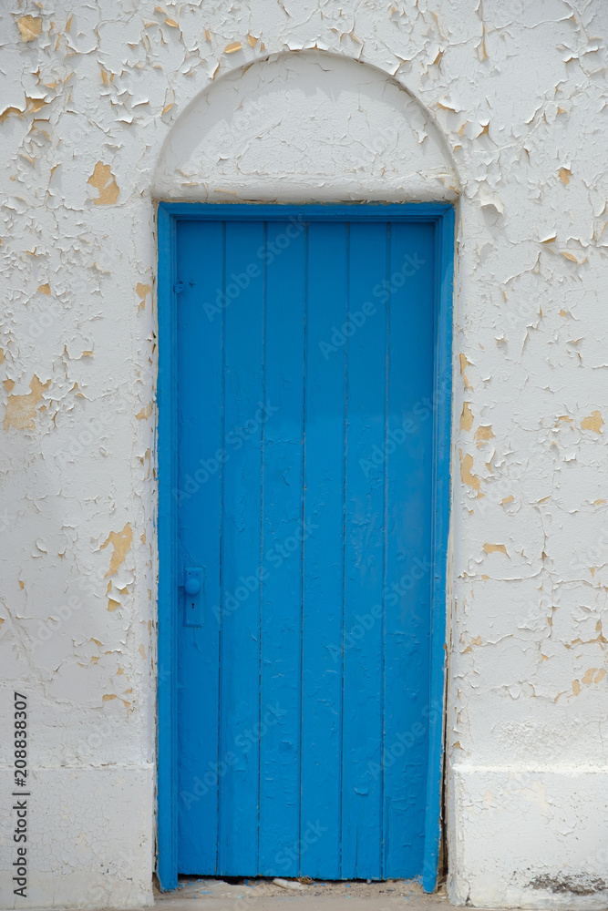 Blue door and white wall at an old Opera House in the California Desert