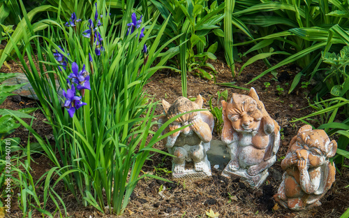 garden figures of animals representing the saying: see no evil, say no evil, hear no evil