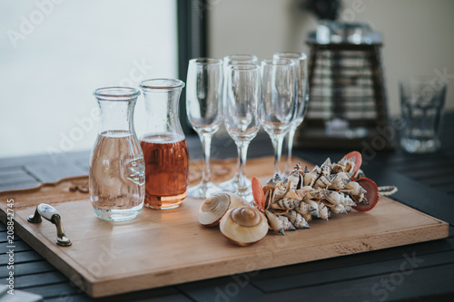 Glasses for Ros? wine and water lined up for small event on the boat photo