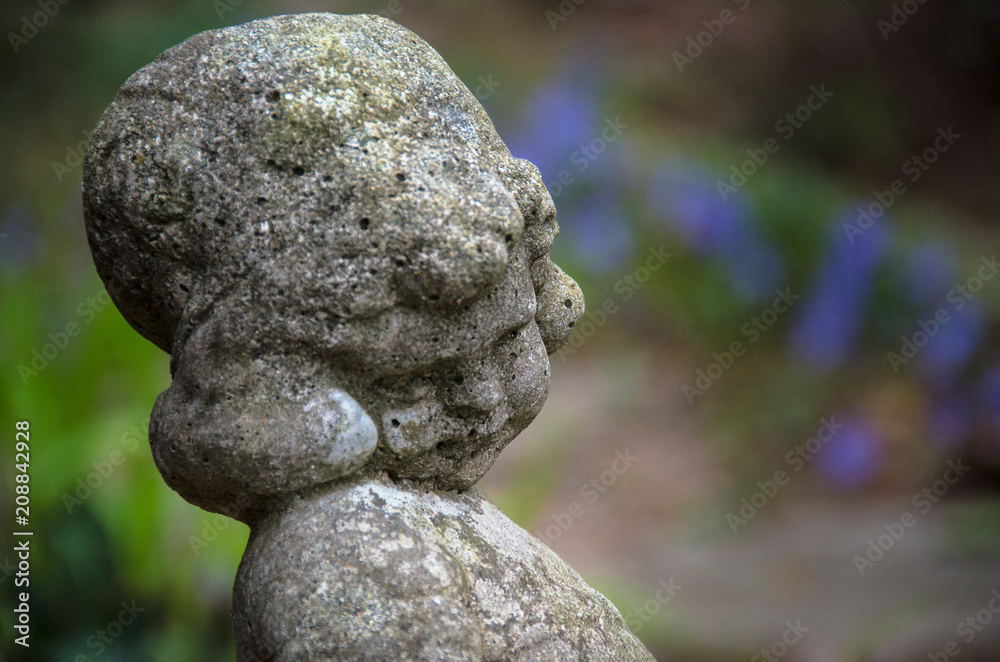 Concrete Statue of Girl in a Garden