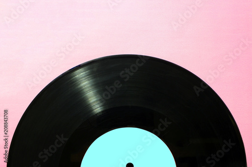Disc music blank vinyl album cover sleeve sleeve layout. Gramophone musical plate on a pink background