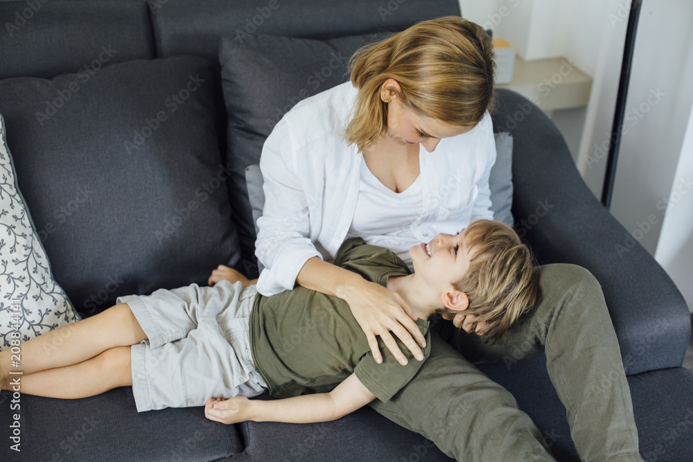 Mother cuddling with kid at home Mother cuddling with kid at home