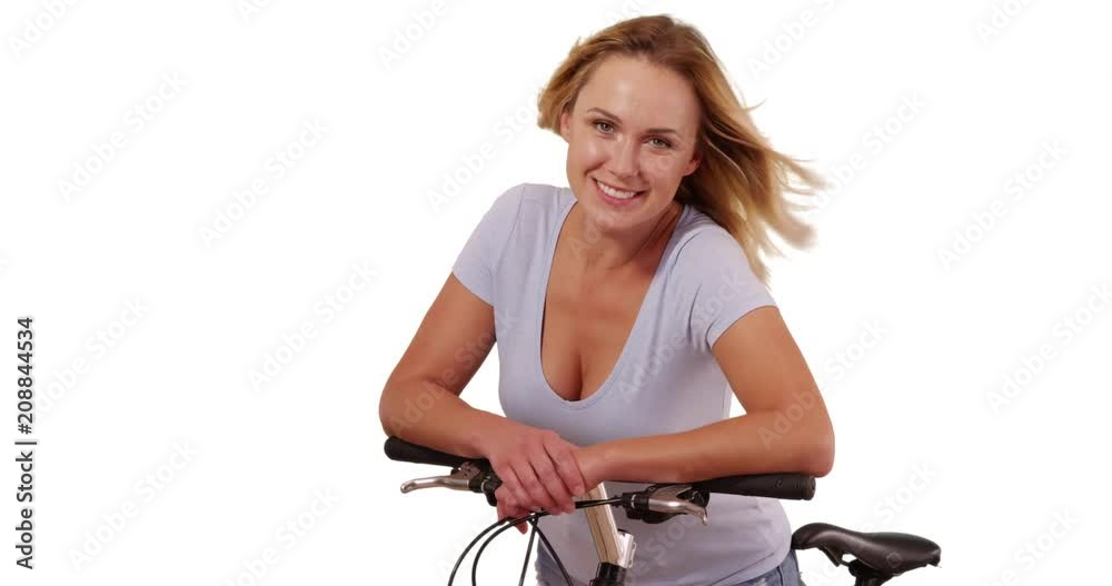 Portrait of pretty white woman on bicycle looking at camera on white copy space, Healthy blonde female cyclist smiling at camera on solid white background, 4k Portrait of pretty white woman on bicycle looking at camera on white copy space, Healthy blonde female cyclist smiling at camera on solid white background, 4k