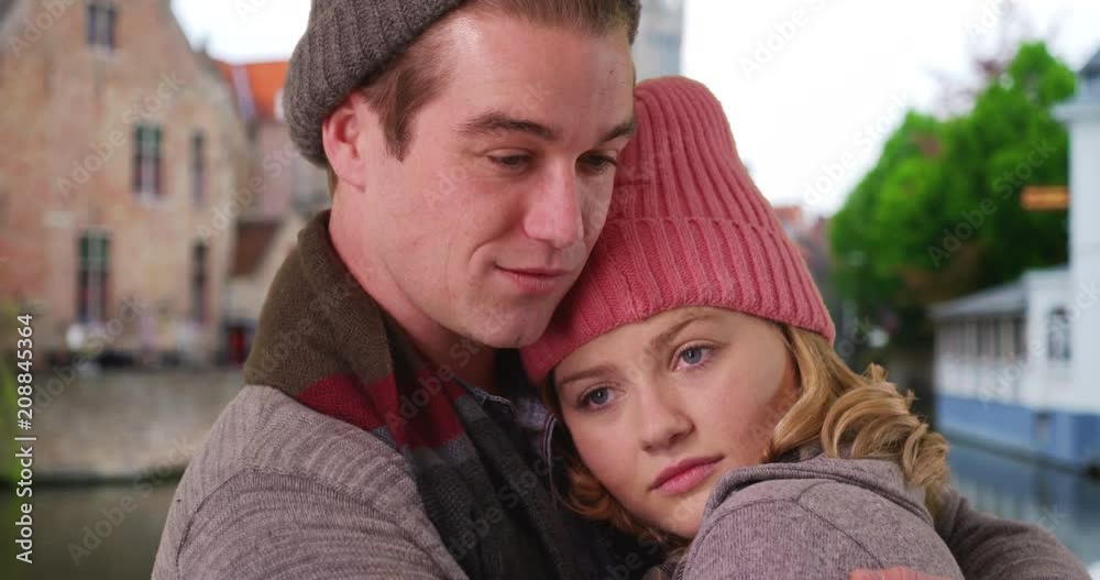 Close up portrait of loving young couple embracing outdoors, Caucasian male and female on holiday in Bruges hugging, 4k Close up portrait of loving young couple embracing outdoors, Caucasian male and female on holiday in Bruges hugging, 4k