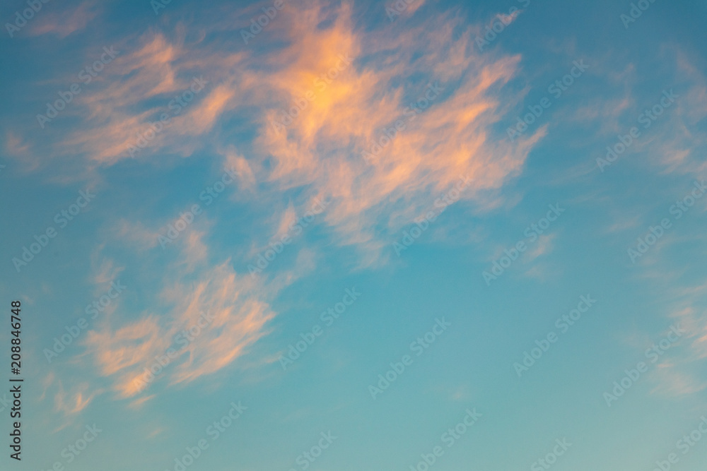 background. beautiful evening blue sky with orange clouds. defocus