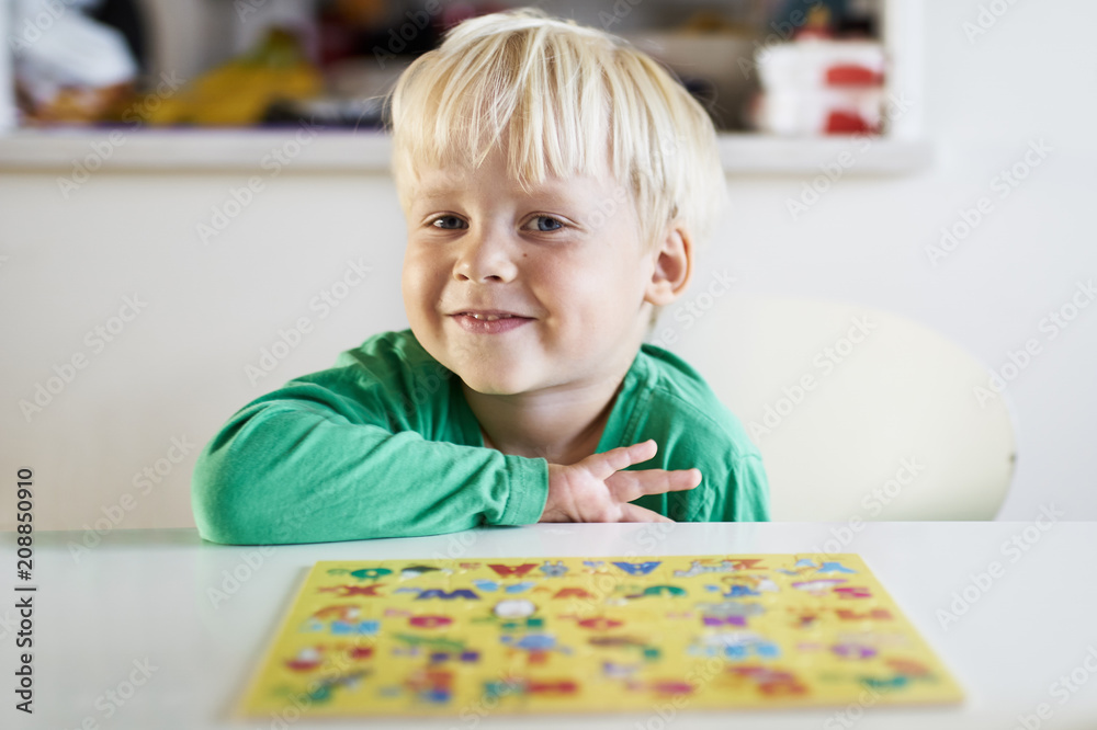 Curious boy with a puzzle Curious boy with a puzzle