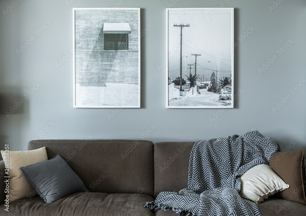 Sofa, wall art in modern living room Stock Photo | Adobe Stock