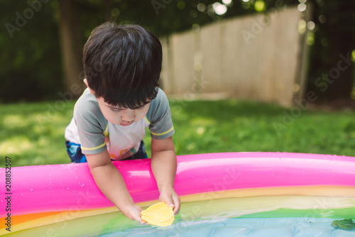 Little kid playing with water