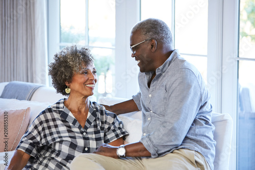 African American Senior Couple laughing and having a good time together at home