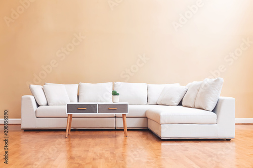 White sectional couch in a large luxury interior home