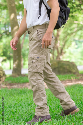 male tourist in the park. Tourism and travel concept, cargo pants