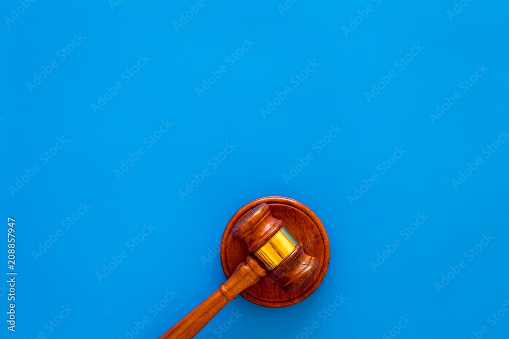 Law and court. Lawyer, attorney, judge concept. Judge gavel on blue background top view copy space Law and court. Lawyer, attorney, judge concept. Judge gavel on blue background top view copy space